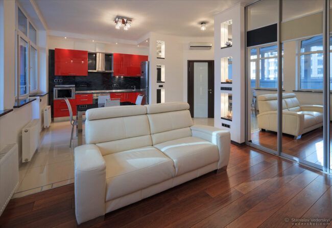 interior of the modern apartments, design in white and red colours with big mirrors. property photography