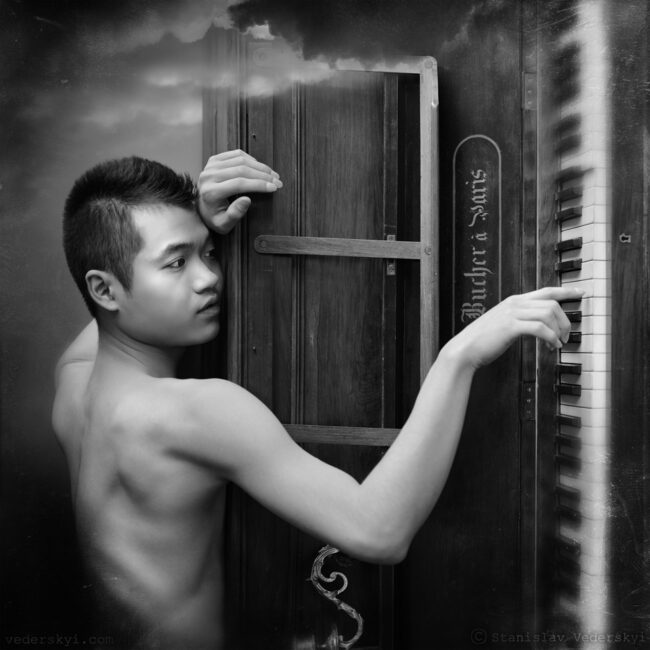 young male leaning on piano. Muddy photosession for musician in black and white colours. stylized as old vintage photo
