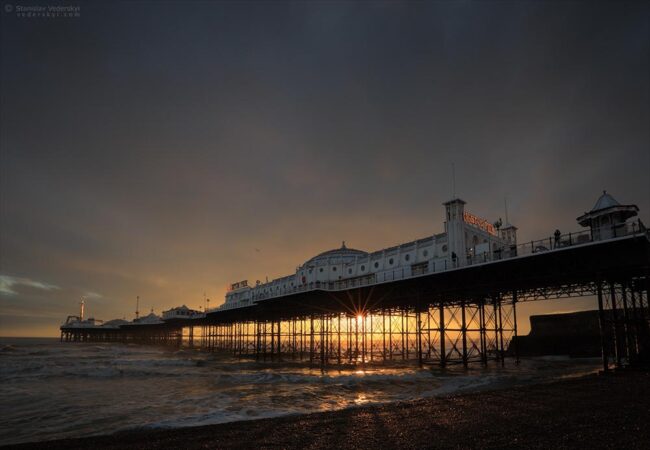 Brighton pier at dramatic sunset time