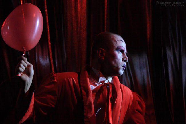 clown in red performing in the show