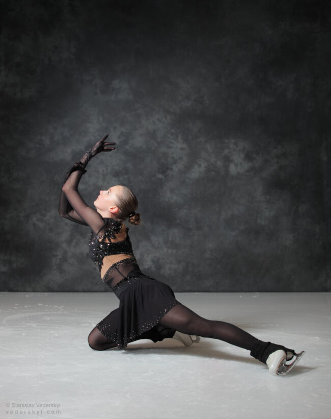figure skating girl in posing dress art photosession on ice