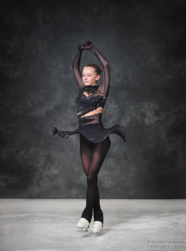 figure skating girl in posing dress art photosession on ice
