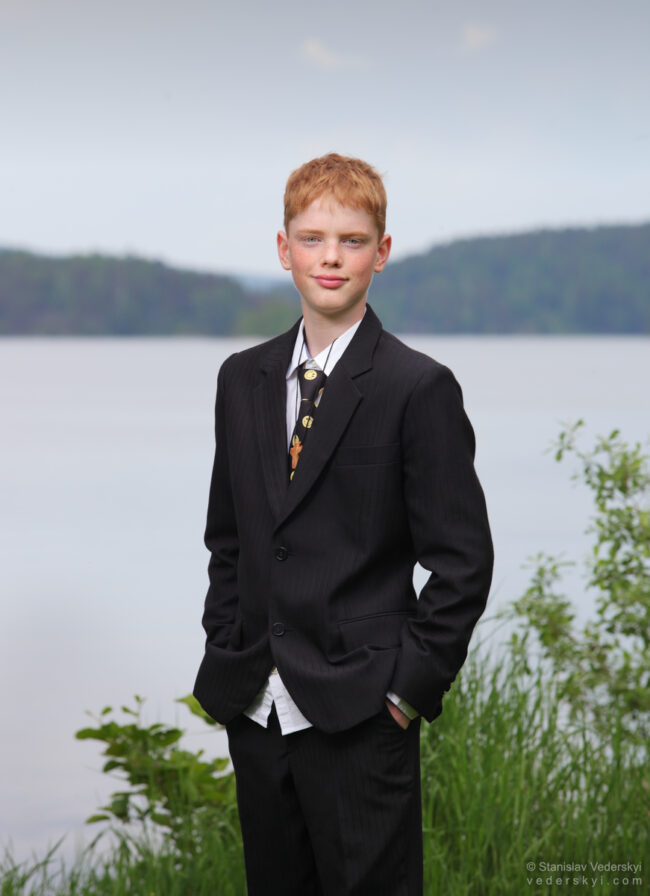Boy in suit, photosession after confirmation in the park Sarpsborg