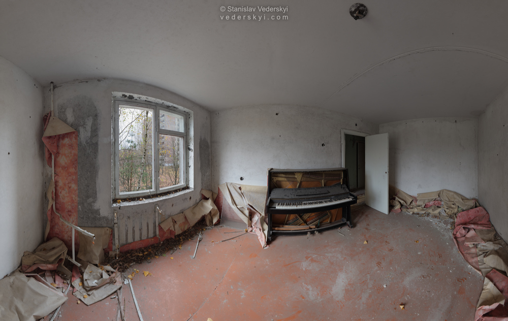 Pripyat-PianoRoom-1-1000 Chernobyl zone Multirow panorama shot inside derelict room in apartments with broken piano, abandoned Pripyat ghost town of Chernobyl exclusion zone, Ukraine.