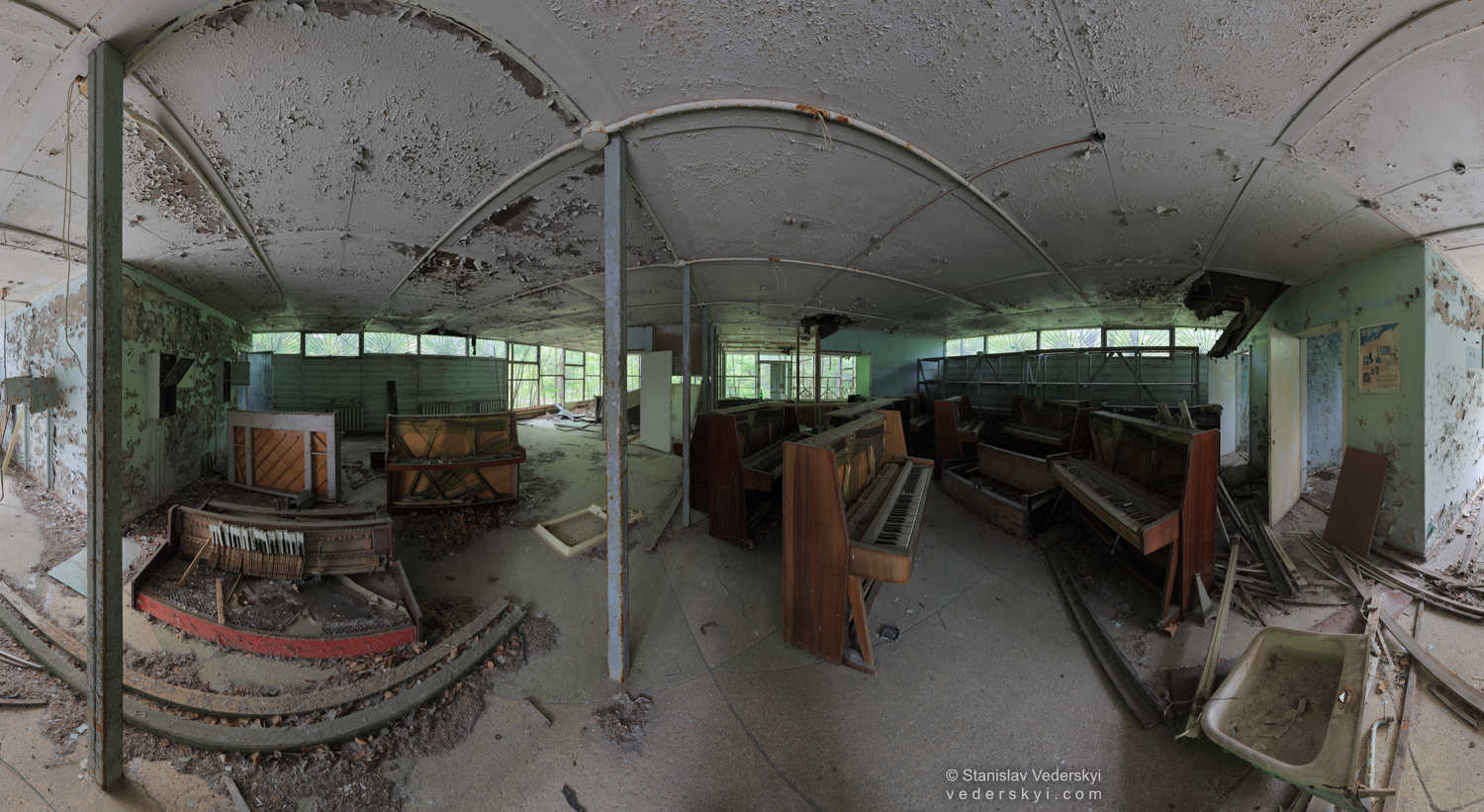 Chernobyl-Pripyat-Mausoleum-of-pianos-1-1500×800 Multirow panorama shot inside of the room with many broken pianos. Pripyat ghost town in Chernobyl Exclusion zone